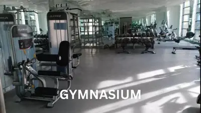a gym with several treadmills and machines in it at Cozy 1 Bedroom Apartment for Long Term Rentals in Manila