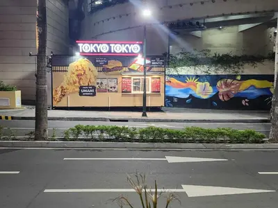 a tko tokyo restaurant on the side of a building at 1 Bed Apartment - Sleeps 7 - Pool & Wifi in Manila