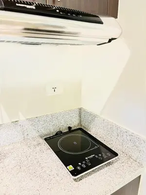 a tablet sitting on top of a kitchen counter at Hayahay Vacay in Manila