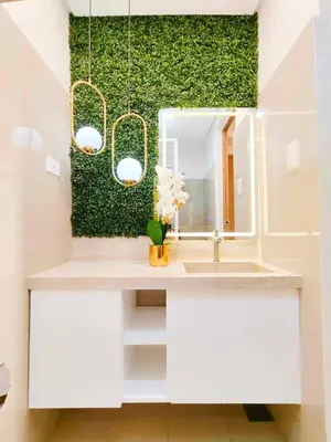 a bathroom with a sink and a mirror at Premium Condotel Close To MOA in Manila