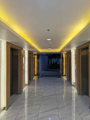 a hallway of a building with a hallwayngth at Mall of Asia Pasay Shore 3 Residence in Manila