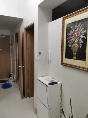 a room with a picture of a vase on the wall at Mall of Asia Pasay Shore 3 Residence in Manila