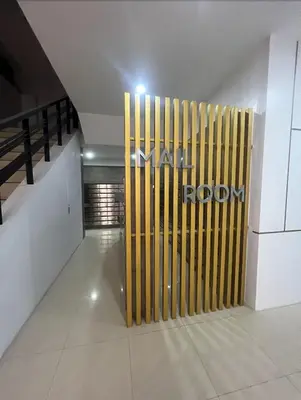 a lobby with a large yellow gate in a building at POEA Mega Mall WiFi Netflix in Manila