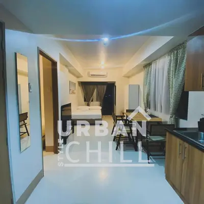 a living room with a kitchen and a dining room at Urban Style Chill, Shore 3, MOA Complex, Pasay, Manila in Manila