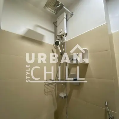 a bathroom with a shower and a sign that reads under the chain at Urban Style Chill, Shore 3, MOA Complex, Pasay, Manila in Manila