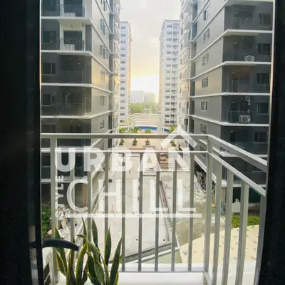 a view from a balcony in a building with tall buildings at Urban Style Chill, Shore 3, MOA Complex, Pasay, Manila in Manila