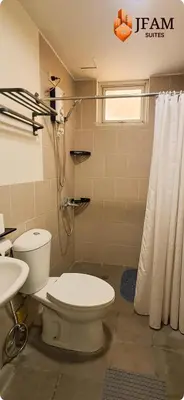 a bathroom with a toilet and a shower at JFam Suites, C1-5L 1BR , Up To 7 Pax in Biñan
