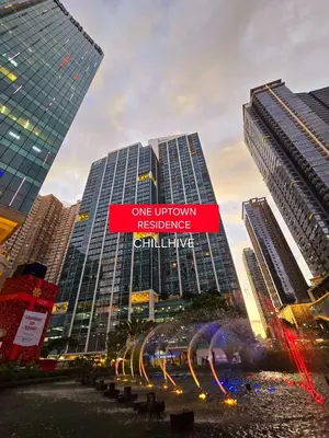 a view of two tall buildings in a city at Chic BGC Condo Across Uptown Mall #ournw9b in Manila