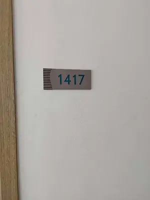 a sign on a wall with a clock on it at Shore Res 2 Br 2Bath 1417 in Manila