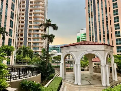 a gazebo in a city with tall buildings at Bell Place at Venice Luxury Mckinley Hill in Manila