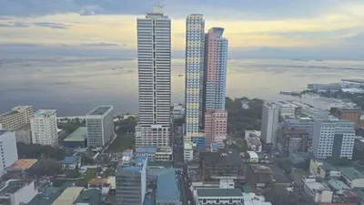 a city with tall skyscrapers in a city at 8 Adriatico Manila Condotel Sea View Corner Unit Near St Lukes Clinic in Manila
