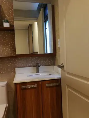 a bathroom with a sink and a mirror at Adria Residences - Diamond Garden - 2 Bedroom Unit for 4 Person in Manila