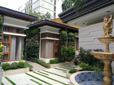 a house with a fountain in front of it at Adria Residences - Diamond Garden - 2 Bedroom Unit for 4 Person in Manila