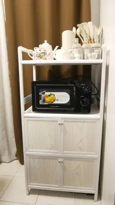 a microwave on a shelf with a plate of food at Experience Santa Rosa Comfort at MEGAN Montagne Suite in Santa Rosa