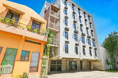 an exterior view of a building at Spot On Classy Bunkbeds Near Makati Manila Formerly MYTOWN Madrid in Manila