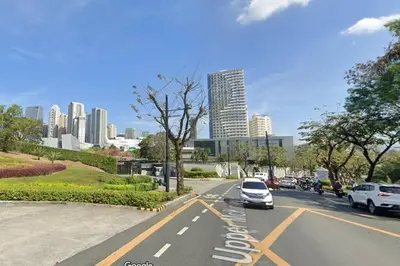 a city street with cars parked on the road at 1BR Condotel Ridgewood Towers Taguig City #RW04 in Manila
