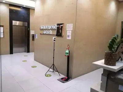 a elevator with a sign on a wall with a camera at 1BR Condotel Ridgewood Towers Taguig City #RW05 in Manila