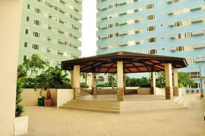 a gazebo in front of a tall building at 1BR Condotel Ridgewood Towers Taguig City #RW08 in Manila