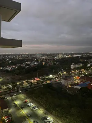a view of a city at night with cars at Beans Crib Staycation at SMDC Green 2 Residences in Dasmariñas
