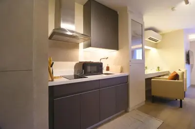 a kitchen with a sink and a microwave at Luxury Oasis in Makati with Balcony in Manila