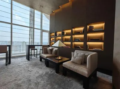 a living room with a couch and a table at Luxury Oasis in Makati with Balcony in Manila