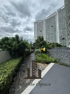 a walkway in front of some tall buildings at Infinite Space at Acqua Private Residences - Iguazu Tower in Manila