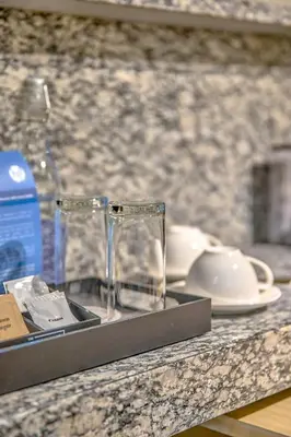 two empty glasses sitting on a counter top at The Connor Serviced Residences Managed by HII in Manila