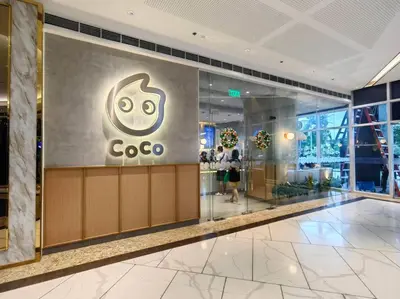 a cisco store in a building with a sign on the wall at 1BR Condotel with Balcony at FAME Residences #FM02 in Manila