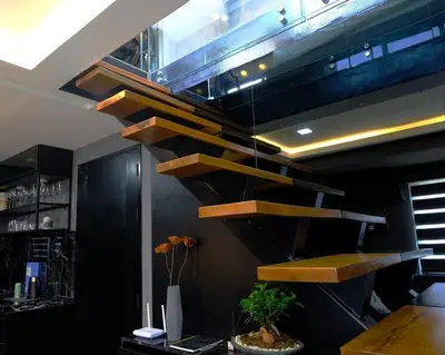 a stairway in a room with at Casa Rica for adventurous fun - C Fort TB in Manila
