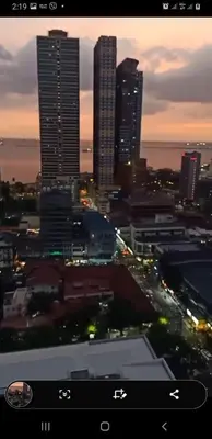 a view of a city at night with tall buildings at 8 Adriatico Condotel Unit Facing Manila Bay in Manila