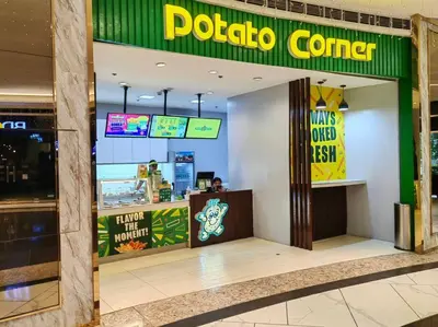 a polo corner restaurant with a person sitting at a counter at 1BR Condotel with Balcony at FAME Residences #FM05 in Manila