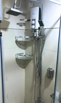 a shower in a bathroom with a shower head at S Residences Luxury Unit in Manila