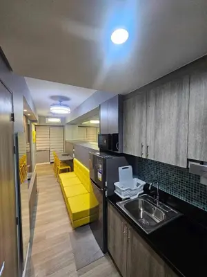 a kitchen with a sink and a counter top at S Residences Luxury Unit in Manila