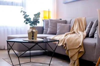 a living room with a couch and a table at Antel Spa & Serenity Suites in Manila
