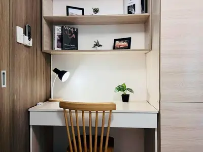 a desk with a chair and a desk with a lamp at 1BR Condotel with Balcony at FAME Residences #FM19 in Manila