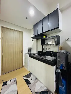 a kitchen with a sink and a counter top at Jasrich Suite Behind SM trece martires HOPE RESIDENCES SMDC in Cavite
