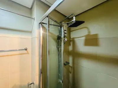 a shower with a glass door in a bathroom at 1BR Condotel with Balcony at FAME Residences #FM41 in Manila