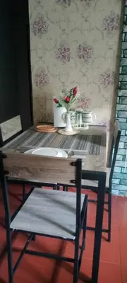 a wooden table with a sink and a chair at 3J's Place in General Trias
