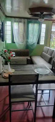 a living room with a couch and a table at 3J's Place in General Trias