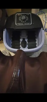 a close up of a shoe next to a hair dryer at Condotel Near NAIA - massage chair footspa, dance revo, small pet allowed in Manila