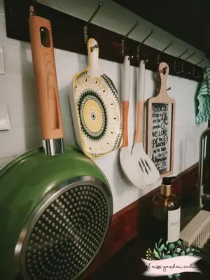 a kitchen counter with knives and utensils on a wall at El Nissi Staycation, THE GARDEN CABIN, Enchanted Kingdom in Santa Rosa