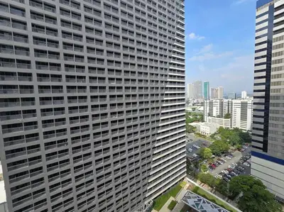 an overhead view of a large building in a city at 1BR Condotel with Balcony at FAME Residences #FM45 in Manila