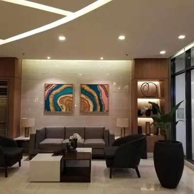 a living room with couches and a coffee table at SPRING RESIDENCES - 2BR Condo near Airport with balcony and pool views in Manila