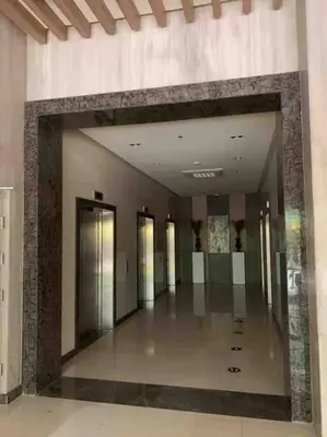 a hallway in a building with many elevators at Studio at viceroy 4 Taguig in Manila