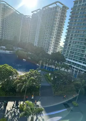an aerial view of a city with tall buildings at Budget Suite Paranaque in Manila