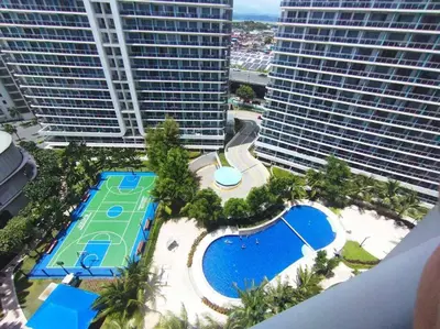 an aerial view of a resort with a pool and buildings at Azure - Stellar Property in Manila