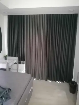 a bedroom with a bed and a window with curtains at High-end 2BR Condo Boracay Tower - Azure Residences near Manila Airport in Manila