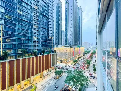 a view of a busy city street with tall buildings at Premium BGC 1BR Condo Near Grand Hyatt #oursw9d1 in Manila
