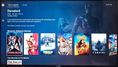 a tv screen with a bunch of superheroes movies at City Life Suite Uptown BGC in Manila