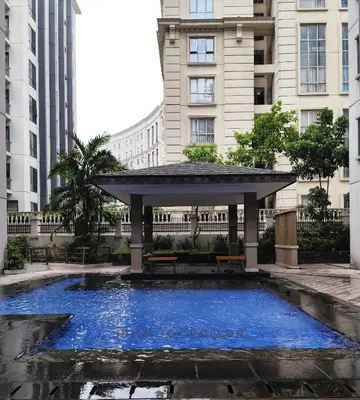 a gazebo with a blue pool in a city at Condotel Near Naia Terminal 3 in Manila